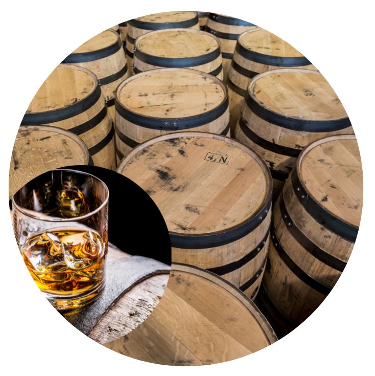 barrels with glass of bourbon in corner